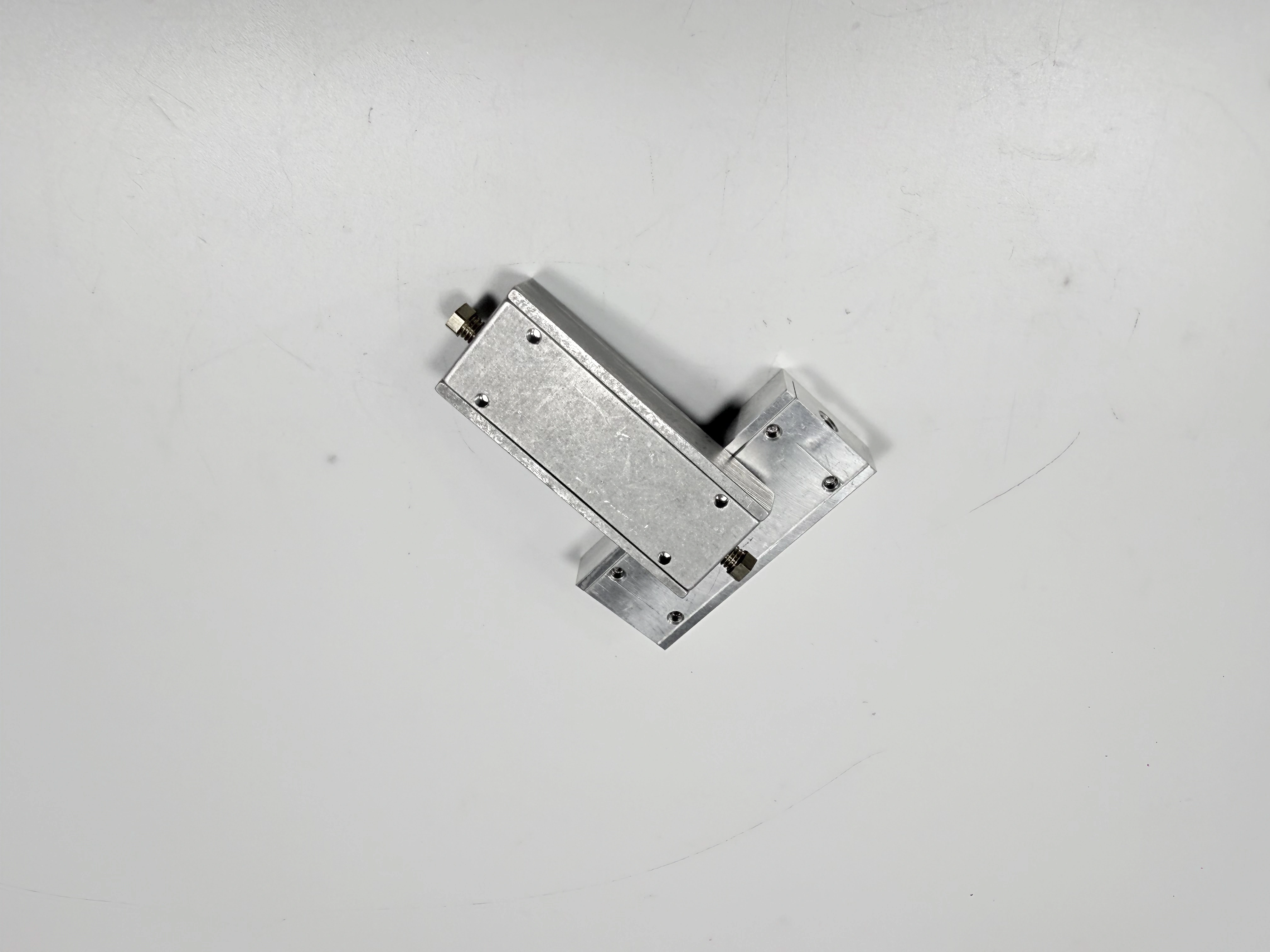 Alternate angle of the same clamping assembly and base features