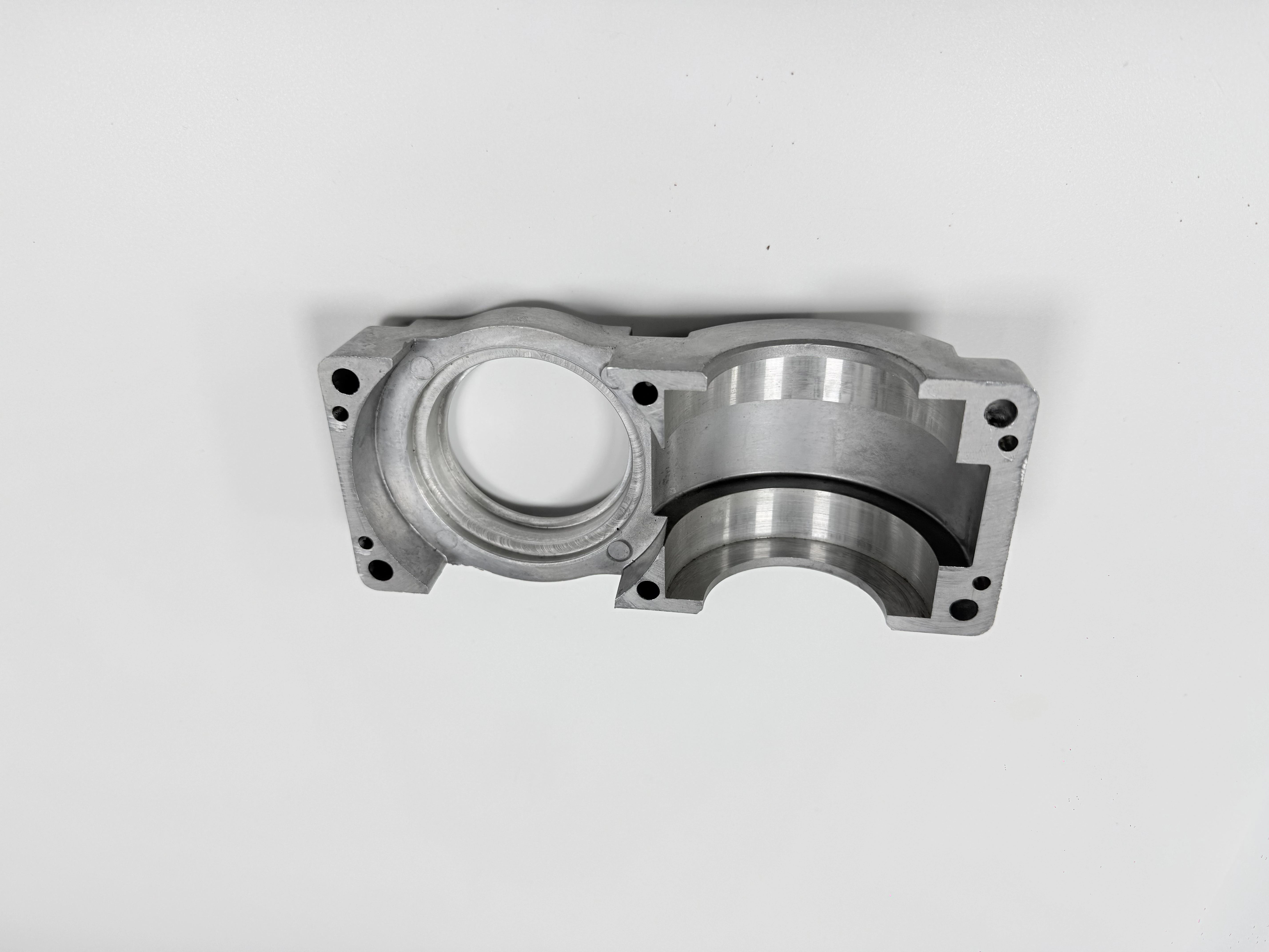 The same split housing showing bore seats and machined mounting faces from a second view