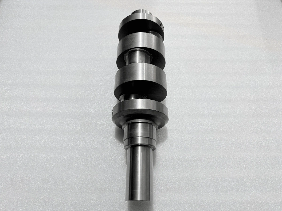 View of a machined crankshaft showing shaft ends and offset crankpins