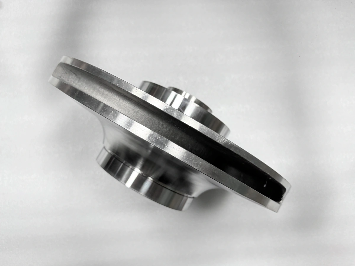 Side view of a closed pump impeller showing the hub and outer rim
