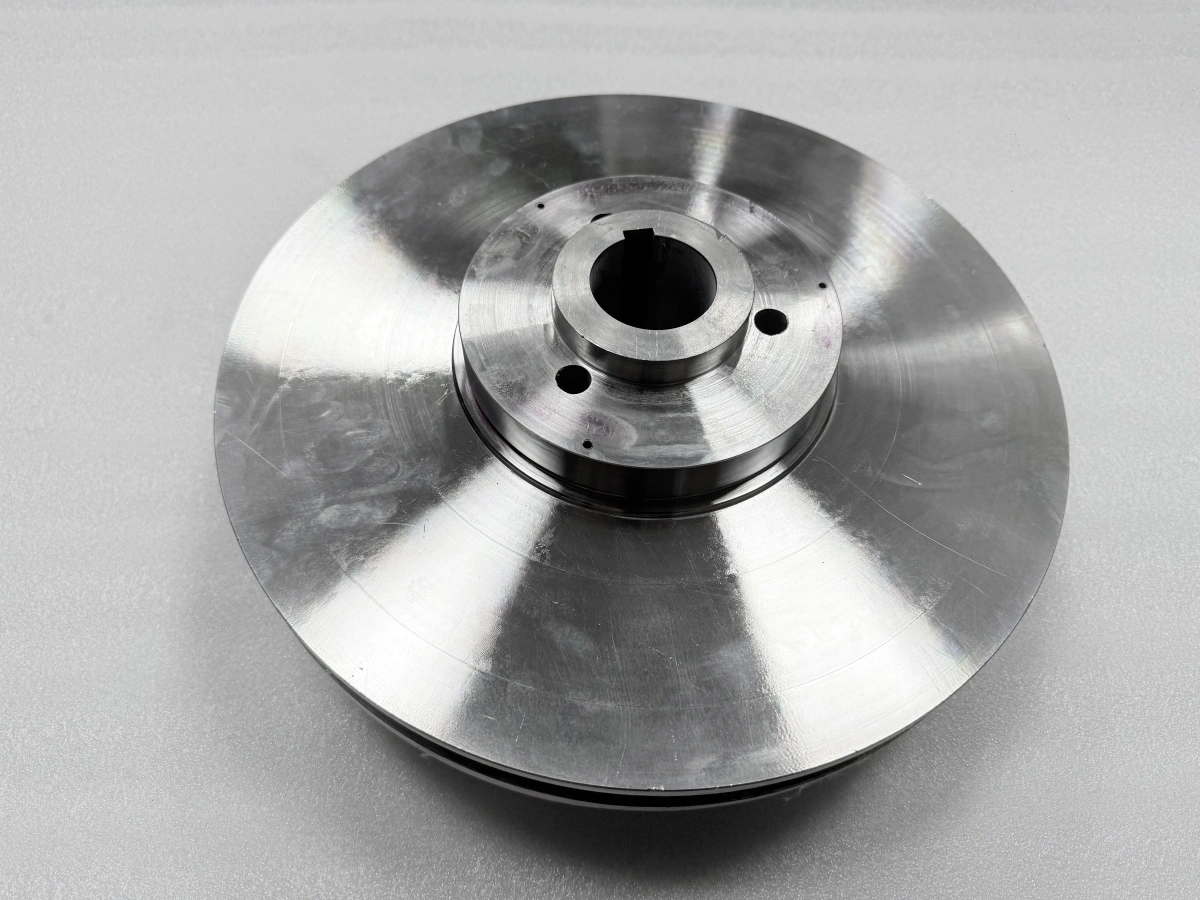 Shaft-bore side of a closed pump impeller with a visible keyway