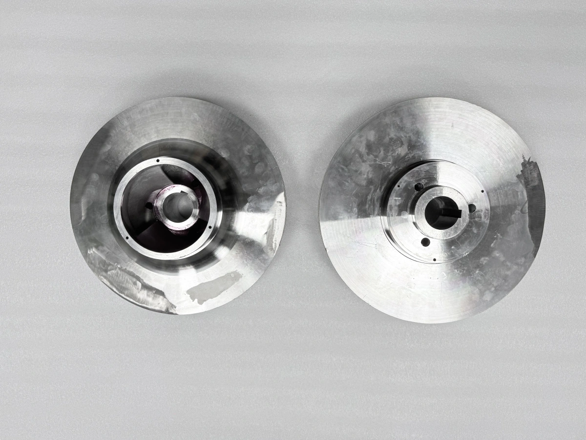 Two closed pump impellers arranged at different viewing angles